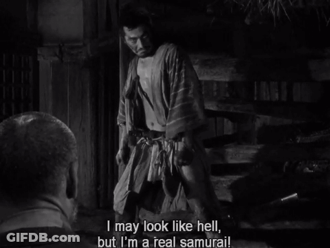 A Black And White Photo Of A Man Saying " I May Look Like Hell " GIF