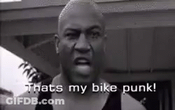 A Black And White Photo Of A Man Saying `` That 'S My Bike Punk '' . GIF
