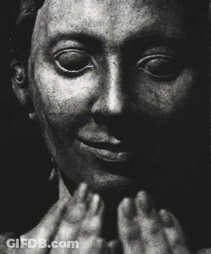 A Black And White Photo Of A Man Screaming With His Mouth Open GIF