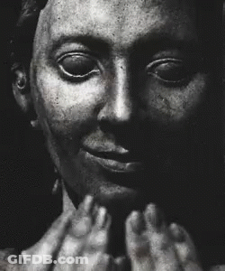 A Black And White Photo Of A Man Screaming With His Mouth Wide Open GIF