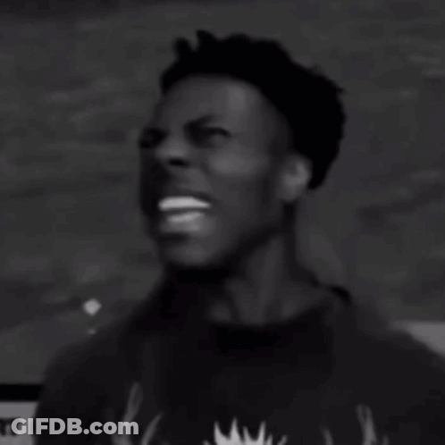 A Black And White Photo Of A Man Screaming With His Mouth Wide Open . GIF