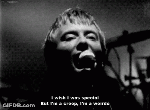 A Black And White Photo Of A Man Singing Into A Microphone With The Caption I Wish I Was Special GIF
