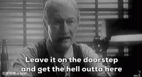 A Black And White Photo Of A Man Sitting At A Table With The Words `` Leave It On The Doorstep '' . GIF