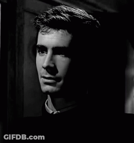 A Black And White Photo Of A Man Smiling GIF