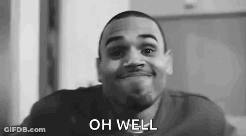 A Black And White Photo Of A Man Smiling With The Words `` Oh Well '' Written On His Face . GIF