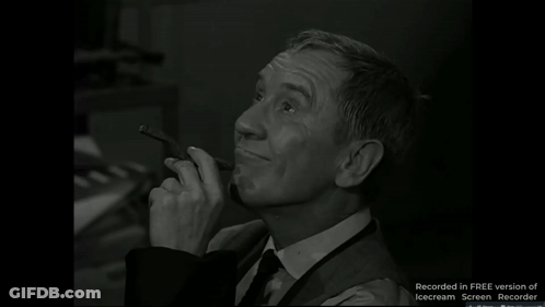 A Black And White Photo Of A Man Smoking A Pipe With The Words Recorded In Free Version Of Icecream Screen Recorder Belo GIF