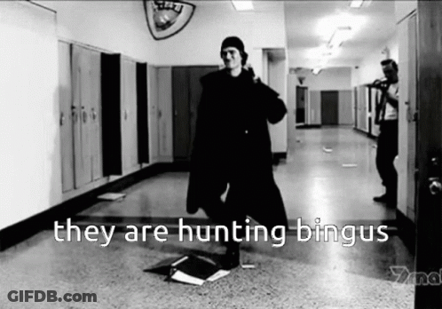 A Black And White Photo Of A Man Standing In A Hallway With The Words They Are Hunting Bingus GIF