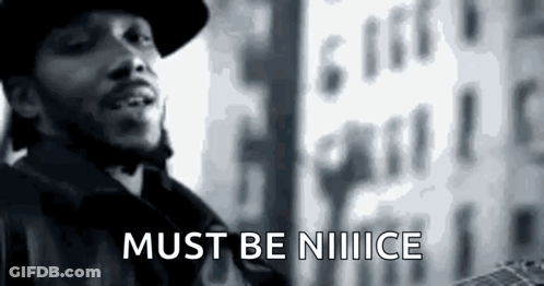 A Black And White Photo Of A Man Standing In Front Of A Building With The Words `` Must Be Notice '' . GIF