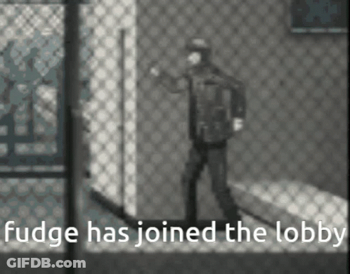 A Black And White Photo Of A Man Standing In Front Of A Chain Link Fence With The Caption Fudge Has Joined The Lobby . GIF