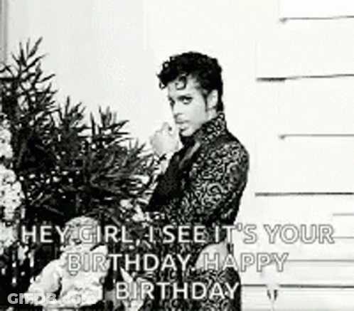A Black And White Photo Of A Man Standing In Front Of A Christmas Tree With A Birthday Message . GIF