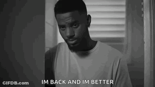 A Black And White Photo Of A Man Standing In Front Of A Window And Saying `` Im Back And Im Better '' . GIF