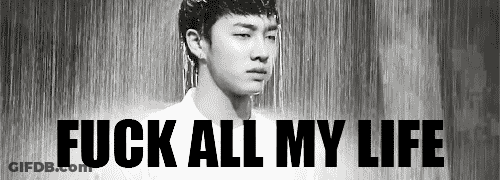 A Black And White Photo Of A Man Standing In The Rain With The Words `` Fuck All My Life '' Written Above Him . GIF