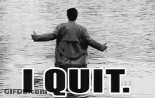 A Black And White Photo Of A Man Standing In The Water With The Words `` I Quit '' Written On The Bottom . GIF