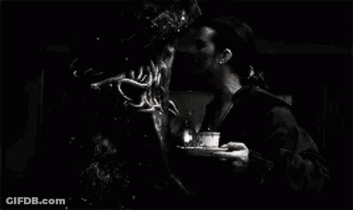 A Black And White Photo Of A Man Standing Next To A Monster In A Pirate Costume . GIF
