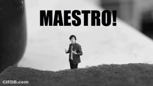 A Black And White Photo Of A Man Standing On A Hill With The Words Maestro Behind Him GIF