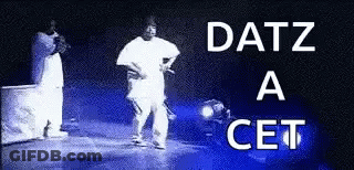 A Black And White Photo Of A Man Standing On A Stage With The Words Datz A Cet Written Above Him . GIF