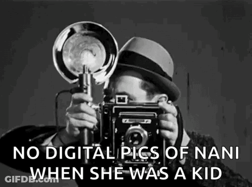 A Black And White Photo Of A Man Taking A Picture Of A Woman With A Camera . GIF
