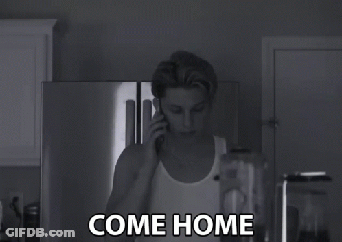 A Black And White Photo Of A Man Talking On A Cell Phone With The Words Come Home Written Below Him GIF