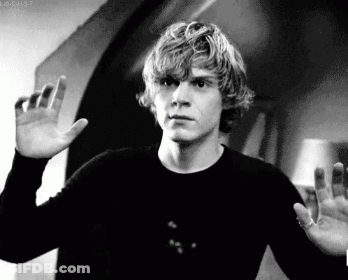 A Black And White Photo Of A Man Waving His Hand GIF