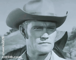 A Black And White Photo Of A Man Wearing A Cowboy Hat Has The Year 2006 On It GIF