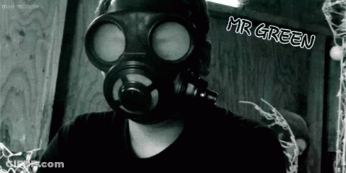 A Black And White Photo Of A Man Wearing A Gas Mask With Mr Green Written On The Bottom GIF