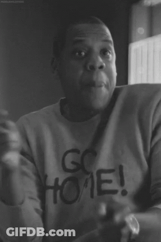A Black And White Photo Of A Man Wearing A Go Home Sweatshirt GIF