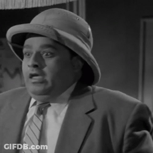 A Black And White Photo Of A Man Wearing A Hat GIF