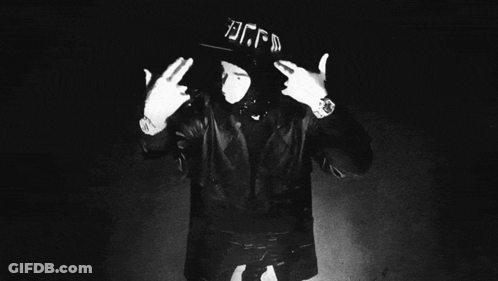 A Black And White Photo Of A Man Wearing A Hat With The Letters Bgfd On It GIF