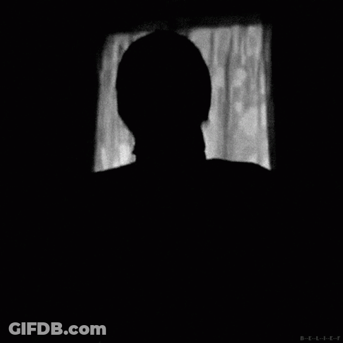A Black And White Photo Of A Man Wearing A Mask With The Letters B-E-L-I-E-F Below Him GIF
