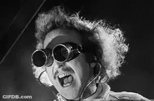A Black And White Photo Of A Man Wearing A Pair Of Goggles . GIF