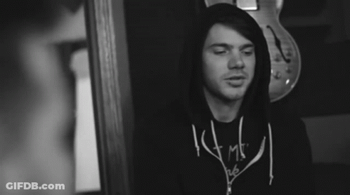 A Black And White Photo Of A Man Wearing A Shirt That Says ' I Am ' GIF