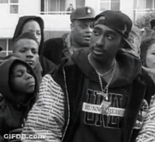 A Black And White Photo Of A Man Wearing A Sweatshirt That Says ' Runnin ' On It GIF