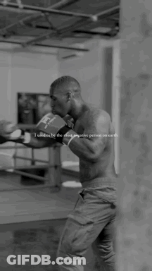 A Black And White Photo Of A Man Wearing Boxing Gloves With The Words " I Used To Be The Most Negative Person On Earth " GIF