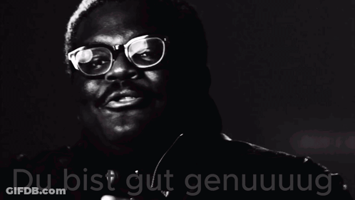 A Black And White Photo Of A Man Wearing Glasses And The Words Du Bist Gut Genuuug GIF