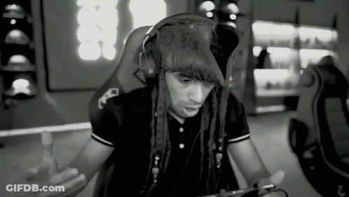 A Black And White Photo Of A Man Wearing Headphones And A Pirate Hat GIF