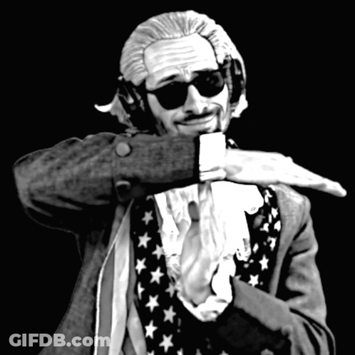 A Black And White Photo Of A Man Wearing Headphones GIF