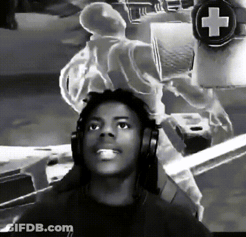 A Black And White Photo Of A Man Wearing Headphones With A Cross In The Background GIF