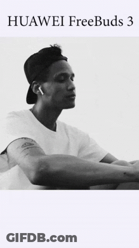 A Black And White Photo Of A Man Wearing Huawei Freebuds 3 Earbuds GIF