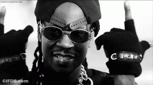 A Black And White Photo Of A Man Wearing Sunglasses And A Hat Giving The Middle Finger GIF