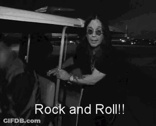 A Black And White Photo Of A Man Wearing Sunglasses And A Shirt That Says Rock And Roll ! GIF