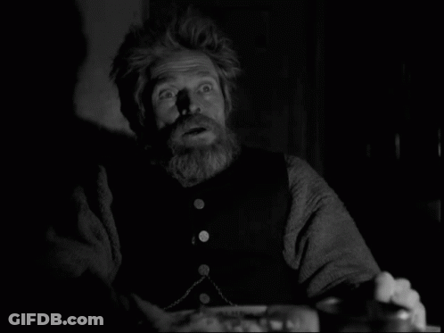 A Black And White Photo Of A Man With A Beard And A Surprised Look On His Face GIF