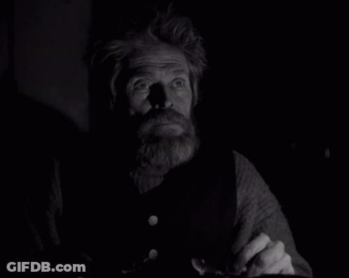 A Black And White Photo Of A Man With A Beard And Missing Teeth GIF