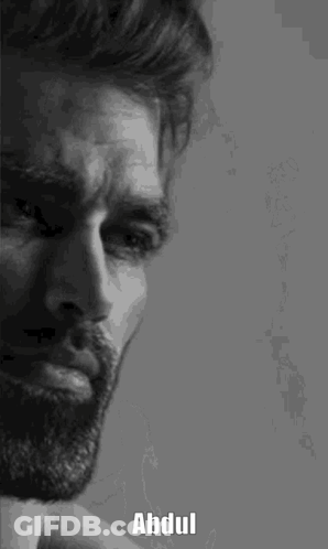A Black And White Photo Of A Man With A Beard And The Name Abdul Written On His Face . GIF