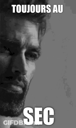 A Black And White Photo Of A Man With A Beard And The Words Toujours Au Sec On The Bottom GIF