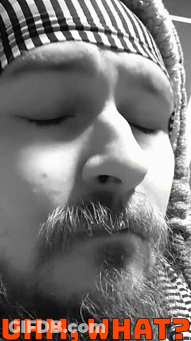 A Black And White Photo Of A Man With A Beard And The Words Uhm What On The Bottom GIF