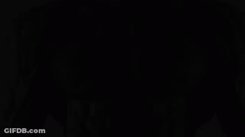 A Black And White Photo Of A Man With A Beard GIF