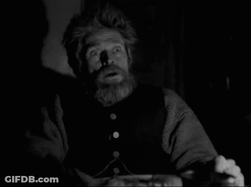 A Black And White Photo Of A Man With A Beard Making A Surprised Face GIF