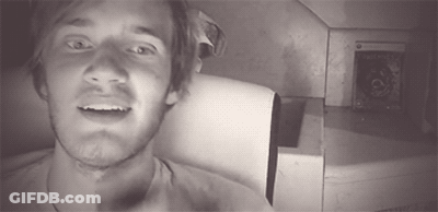 A Black And White Photo Of A Man With A Beard GIF