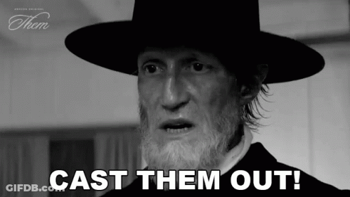 A Black And White Photo Of A Man With A Beard Wearing A Hat . GIF