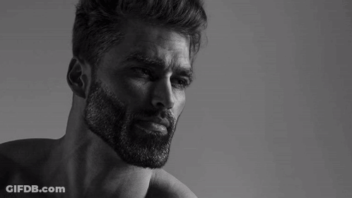 A Black And White Photo Of A Man With A Beard Without A Shirt On . GIF